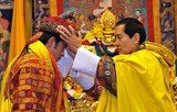 The Druk Gyalpo (Dzongkha: འབྲུག་རྒྱལ་པོ་; Wylie: brug rgyal-po; 'Dragon King') is the head of state of Bhutan. He is also known in English as the King of Bhutan. Bhutan, in the local Dzongkha language, is known as Dryukyul which translates as 'The Land of Dragons'. Thus, while Kings of Bhutan are known as Druk Gyalpo ('Dragon King'), the Bhutanese people call themselves the Drukpa, meaning 'Dragon people'.<br/><br/>

The current ruler of Bhutan is the 5th Hereditary King His Majesty Jigme Khesar Namgyel Wangchuck, who is the 5th Druk Gyalpo. He wears the Raven Crown which is the official Crown worn by the Monarchs of Bhutan. He is correctly styled 'Mi'wang 'Ngada Rimboche' ('His Majesty') and addressed ''Ngada Rimboche' ('Your Majesty').